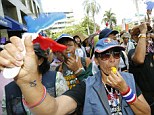 Discontent: Thai anti-government protesters blow whistles and shout slogans calling on the Election Commission to reform before further voting