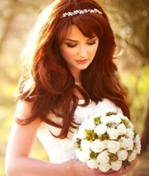 bride with bouquet in sunlight