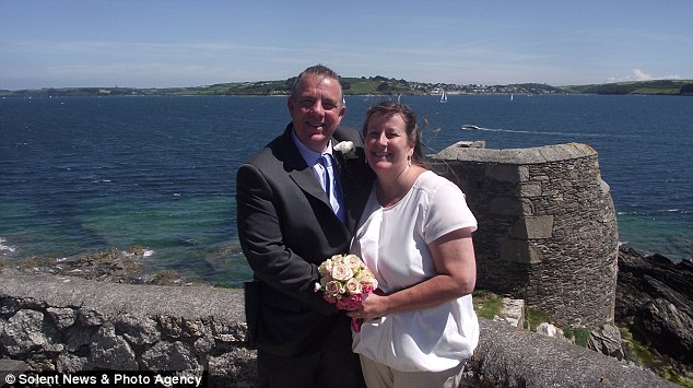 Budget celebration: Mike and Michelle - who met at a Travelodge in 2011 - got married last Thursday