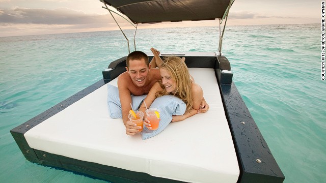 At the Ritz-Carlton, guests pick up the coconut phone to request delivery of sunscreen, magazines, food and drinks from the aqua butler.