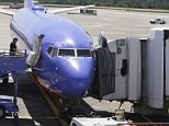 The Southwest Airlines airplane had its jetway, right, suffer a mechanical failure