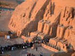 People visit the Great Temple of Ramses II, to observe the sun to send a beam of light into the ancient temple's dark inner chamber for over ten minutes in Abu Simbel, 870 kilometers (540 miles) south of Cairo, Egypt, Wednesday, Oct. 22, 2014. Hundreds of people visited the temple to watch the sun illuminate colossal statues, a rare 3,200-year-old astronomical ceremony that happens twice a year. (AP Photo/Ibrahim Zayed)