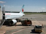 D2J5FK Refuelling an aircraft on the ground at Halifax Airport, Halifax, Nova Scotia
