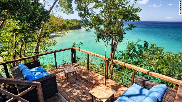 At Secret Bay in Dominica guests stay in one of five tree house-style villas and bungalows.