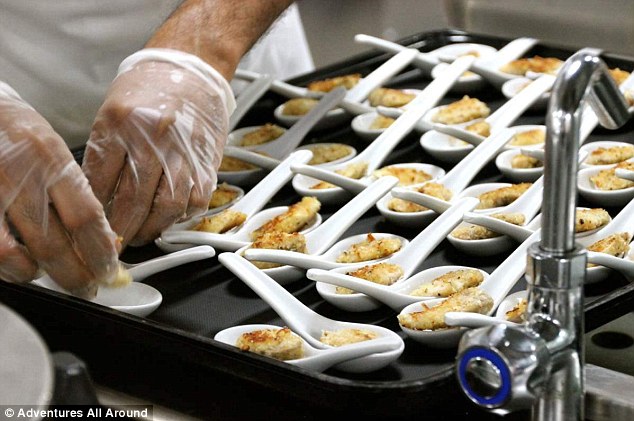 The chefs preparing one of the many dishes on offer to hungry Australians