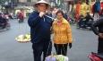 Chris Shepherd poses with a street vendor