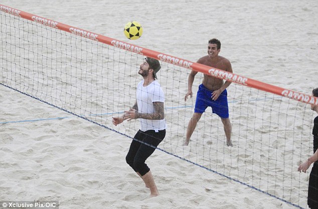 New venture: Beckham takes part in a game of footvolley on Sao Conrado beach in Rio de Janeiro last week