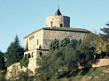 High on the hill: The Castell de Celra lords over its rural setting in Catalonia, near Girona
