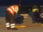 Bagged: Baggage handlers for a Ryanair flight were captured on amateur video at Bergamo Airport