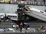  Derailed cars at the site of a train accident near the city of Santiago de Compostela
