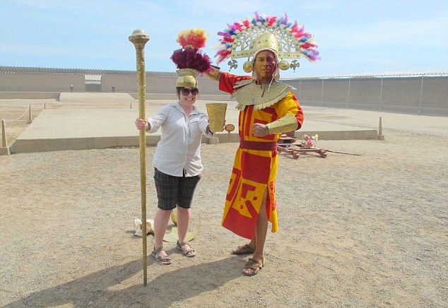 A colourful welcome: Amy tries out pre-Inca headgear in Chan Chan, near Trujillo