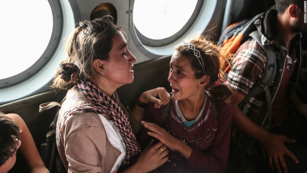 Aziza Hamid, a 15-year-old Iraqi girl, cries for her father while she and some other Yazidi people are flown to safety Monday, August 11, after a dramatic rescue operation at Iraqs Mount Sinjar. A CNN crew was on the flight, which took diapers, milk, water and food to the site where as many as 70,000 people were trapped by ISIS. But only a few of them were able to fly back on the helicopter with the Iraqi Air Force and Kurdish Peshmerga fighters.