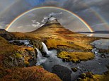 Awe-inspiring: A spectacular rainbow curves over Kirkjufell, in Iceland, snapped by photographer Peter Rolf Hammer