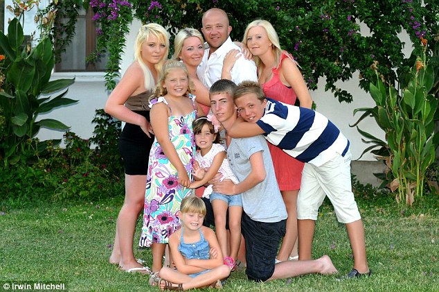 'Devastated': Simon and Davina Nordemann (centre, back) say their honeymoon was ruined by illness