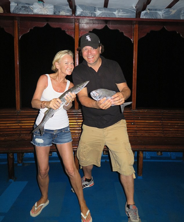 Lisa and Paul with the fish they caught for their cookery lesson at the Park Hyatt