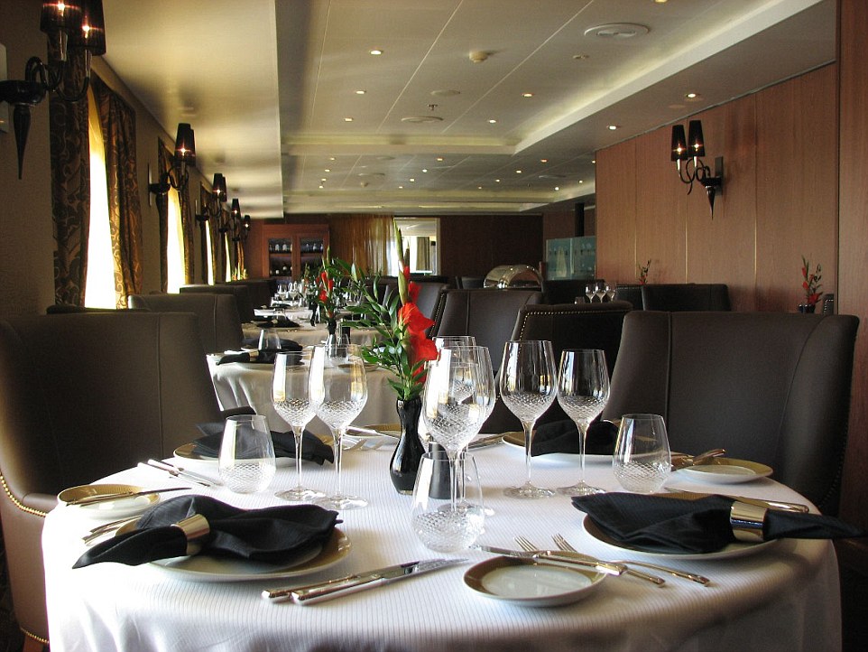 Mouthwatering decor: The insides of the ship are extremely luxurious with guests enjoying a top class restaurant