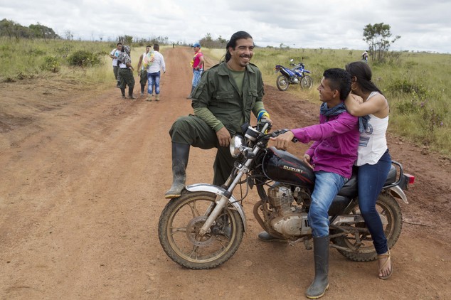 Rebels of the Revolutionary Armed Forces of Colombia, FARC, chat in Yari Plains, southern Colombia, Saturday, Sept. 24, 2016. FARC leaders and delegates conc...
