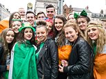 18 Mar 2014, Dublin, Ireland --- Dublin, Ireland. 18th March 2014 -- Group of teenagers at the Central Bank in Dublin. -- As the St. Patricks Day parade in Dublin finished, spectators continued to enjoy themselves on the streets of Dublin. --- Image by   David Gray/Demotix/Corbis