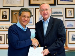 Genting Hong Kong's chairman  CEO, Lim Kok Thay, signs contract with Meyer Werft's managing partner, Bernard Meyer