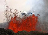MAIN PHOTOT: A daring pilot flies his plane over a volcano as red-hot lava bursts into the sky.  The scorching lava, which is 850 degrees Celsius hot, erupts in the air up to heights of almost 200 feet.On board the little blue and white plane are sightseers, who get an up close view of the spectacular volcano, as they were just 300 metres away.  These stunning pictures were taken by photographer Baldur Sveinsson, who was in another plane flying around the volcano.  SEE OUR COPY FOR DETAILS.Pictured:  The plane flying over the volcano as red-hot lava bursts into the sky.Please byline: Baldur Sveinsson/Solent News© Baldur Sveinsson/Solent News  Photo AgencyUK +44 (0) 2380 458800