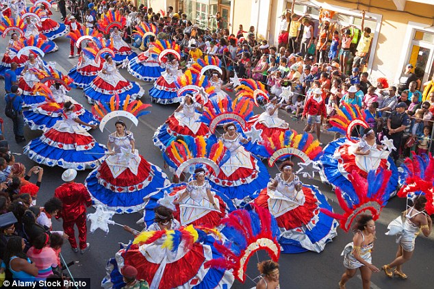 At certain times of the year, some of the islands also host carnival festivities - a well attended event for locals and tourists. Above, the carnival in Mindelo