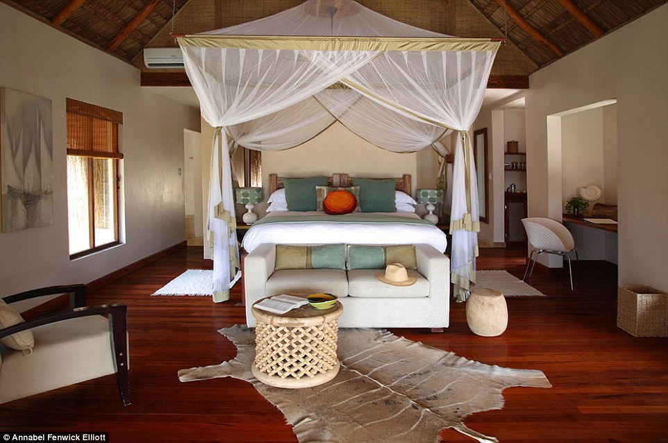 Annabel's magnificent villa and four-poster bed, which was transformed for her into a mosquito-proof capsule every evening
