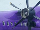 The propeller on a Flybe plane which was disabled by a birdstrike. The plane is seen here landed at Birmingham. See SWNS story SWBIRD: A passenger plane lost one of its propellers in a bird strike on take-off - but continued with the rest of the hour-long flight on just ONE engine. The Flybe service had just left Guernsey for Birmingham when startled passengers heard a bang on the left side. They looked out and saw the front cone of the prop had been smashed and the blades were slowing to a halt. But to their alarm the captain announced that instead of turning round the plane would be carrying on with the single remaining engine.