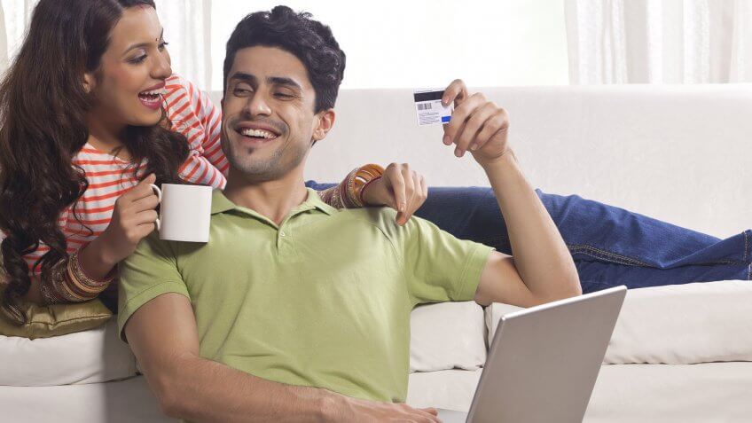 couple laughing on couch