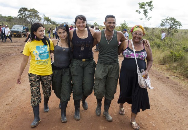 Miriam Vanegas, right, walks with her son Felipe, second from right, and other rebels of the Revolutionary Armed Forces of Colombia, FARC, in Yari Plains, Co...