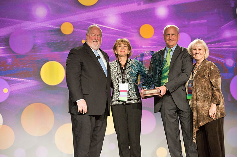 Kathy Davig (on left) and Rebecca Naugler, Block and Perry Lungmus, vice president, Travel Leaders