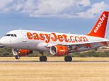 E67A3J An easyJet Airbus A319 landing at Luton Airport in England , Britain , Uk