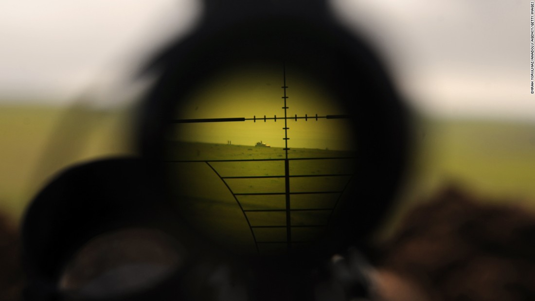 ISIS militants are seen through a rifles scope during clashes with Peshmerga fighters in Mosul, Iraq, on Wednesday, January 21.