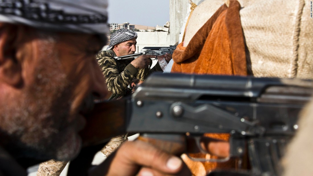 Fighters from the Free Syrian Army and the Kurdish Peoples Protection Units join forces to fight ISIS in Kobani on Wednesday, November 19.