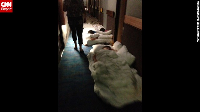 Passengers lie on mattresses in a hallway aboard the Carnival Triumph. 