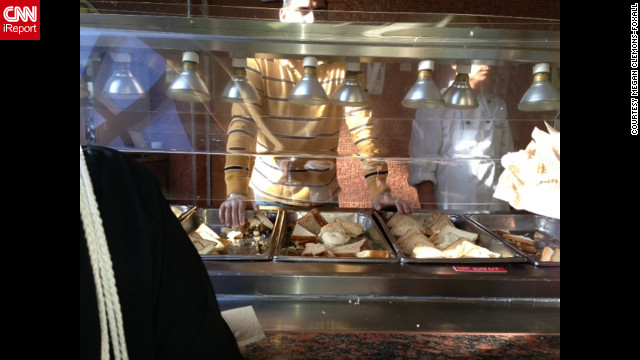 Passengers help themselves to food aboard the ship.