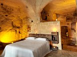 Lap of luxury: The 18 spectacular rooms are set right inside the caves of the mountainside in Southern Italy