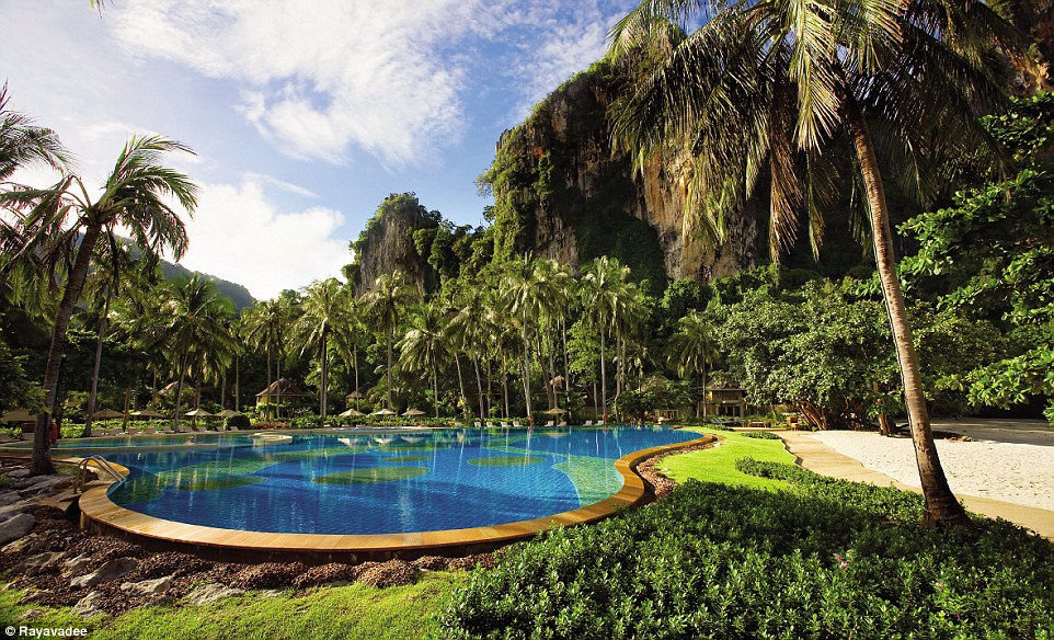 The secluded location sets the tone for romance with its large freeform pool, extensive spa, and opulent beachfront villas