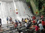 A thorough soaking: Diners get a wet and wild experience at the Waterfalls Restaurant in Villa Escudero