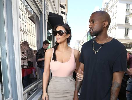 PARIS, FRANCE - MAY 19: Kim Kardashian and Kanye West are seen strolling in the 'Rue Saint Honore' on May 19, 2014 in Paris, France. (Photo by Marc Piasecki/GC Images) PARIS, FRANCE - MAY 19: Kim Kardashian and Kanye West are seen strolling in the 'Rue Saint Honore' on May 19, 2014 in Paris, France. (Photo by Marc Piasecki/GC Images)