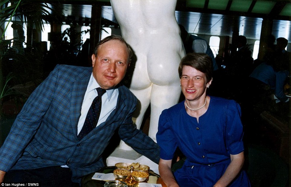 Wish you were rear? This couple posed in an unfortunate location - behind a marble statue of a naked man - while on the ship