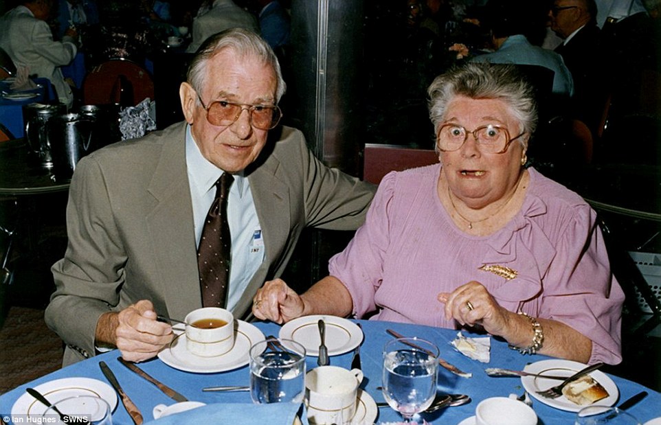 Surprise! A woman, who was clearly not expecting to be photographed, was snapped while enjoying tea with her husband