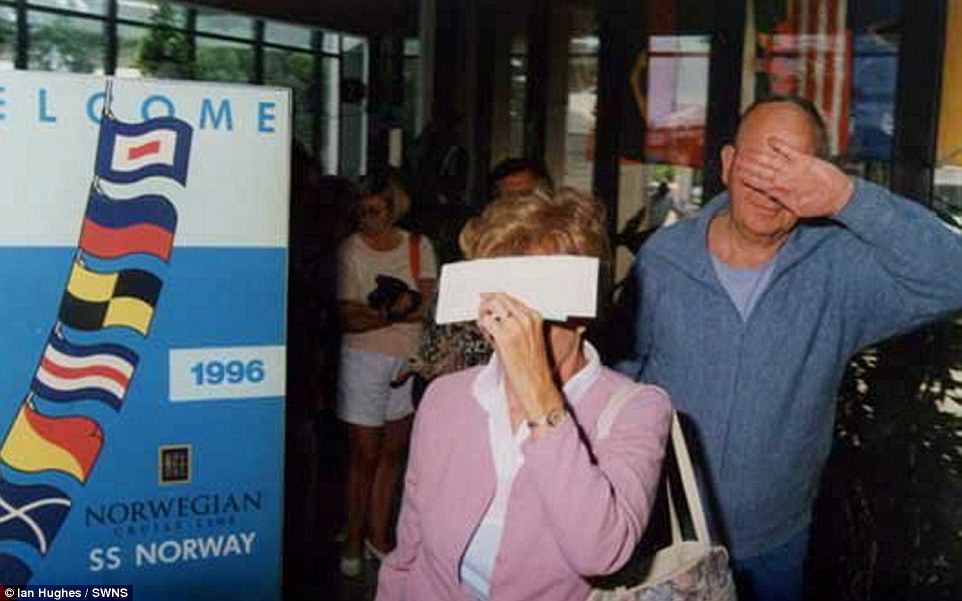 This couple clearly were not keen to have their photo taken as they blocked their faces with their hands and boarding passes 