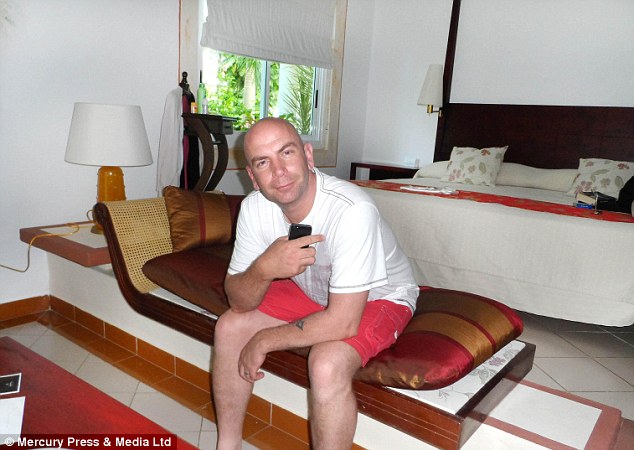 Hotel nightmare: Wesley Dyson, 36, pictured in the second room the couple stayed in after initially being allocated a twin room, despite paying for a honeymoon suite at the Holguin resort