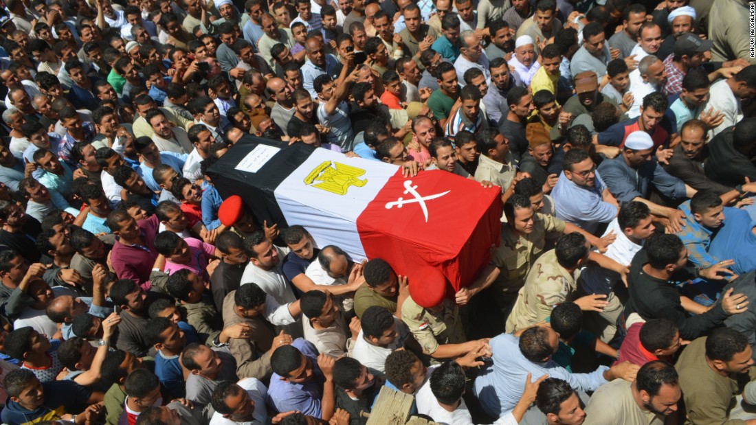 People in Ashmoun, Egypt, carry the coffin for 1st Lt. Mohammed Ashraf, who was killed when the ISIS militant group lt;a href=quot;http://www.cnn.com/2015/07/02/world/isis-egypt-expanding-reach/index.htmlquot; target=quot;_blankquot;gt;attacked Egyptian military checkpointslt;/agt; on Wednesday, July 1. At least 17 soldiers were reportedly killed, and 30 were injured.