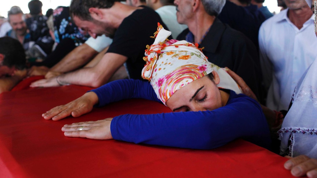 Mourners in Gaziantep, Turkey, grieve over a coffin Tuesday, July 21, during a funeral ceremony for the victims of a suspected ISIS suicide bomb attack. lt;a href=quot;http://www.cnn.com/2015/07/20/world/turkey-suruc-explosion/quot;gt;That bombing killed at least 31 peoplelt;/agt; in Suruc, a Turkish town that borders Syria. Turkish authorities blamed ISIS for the attack.