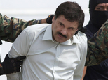FILE - In this Feb. 22, 2014, file photo, Joaquin El Chapo Guzman, head of Mexico¿s Sinaloa Cartel, is escorted to a helicopter in Mexico City, following his capture overnight in the beach resort town of Mazatlan. Mexico¿s security commission said in a statement late Saturday, July 11, 2015, the top drug lord Joaquin ¿El Chapo¿ Guzman has escaped from a maximum security prison, the second time he has fled after being captured. (AP Photo/Eduardo Verdugo, File)