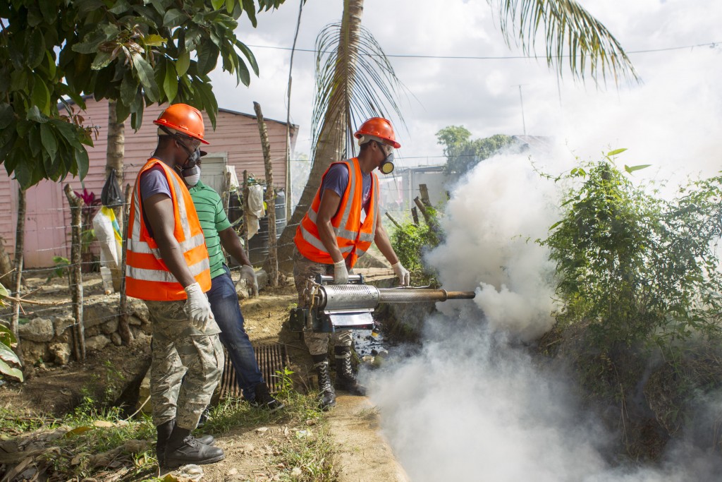 Dominican Air Force personnel fumigate various locations in Santo Domingo against the Aedes aegypti mosquito, which transmitsthe Zika virus. Photo by Erika Santelices/AFP/Getty Images