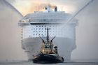 A tug boat leads the way for the world's largest passenger ship, Harmony of the Seas, owned by Royal Caribbean, as it makes her way into Southampton, England. Photo / AP