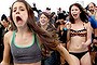 People participate in the annual Coney Island Polar Bear Club dip, in the Brooklyn borough of New York January 1, 2014. The Coney Island Polar Bear Club is the oldest winter bathing organization in the U.S. and every New Year's Day holds the winter plunge which attracts thousands of participants. REUTERS/Allison Joyce (UNITED STATES - Tags: SOCIETY ENVIRONMENT)