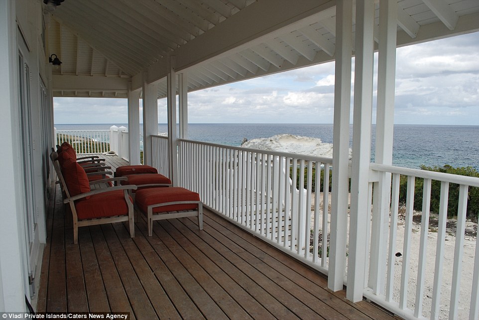 Relax on your private porch overlooking the Ocean on Cave Cay in the Caribbean, Bahamas